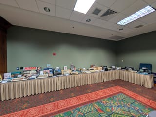 Vintage home computers including Apple II and Commodore 64 set up for visitors